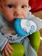 happy-baby-with-his-4akid-blue-teething-mitten