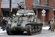 World War II tank gunner Clarence Smoyer's ride through the streets of Boston in a Sherman tank World-War-II-tank-gunner-Clarence-Smoyer-smiles-as-he-admires-a