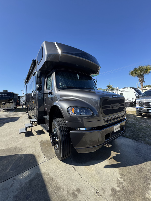 Before and after oxidation removal on a Coachmen Brookstone motorhome: a flat, faded finish restored to reflective gloss