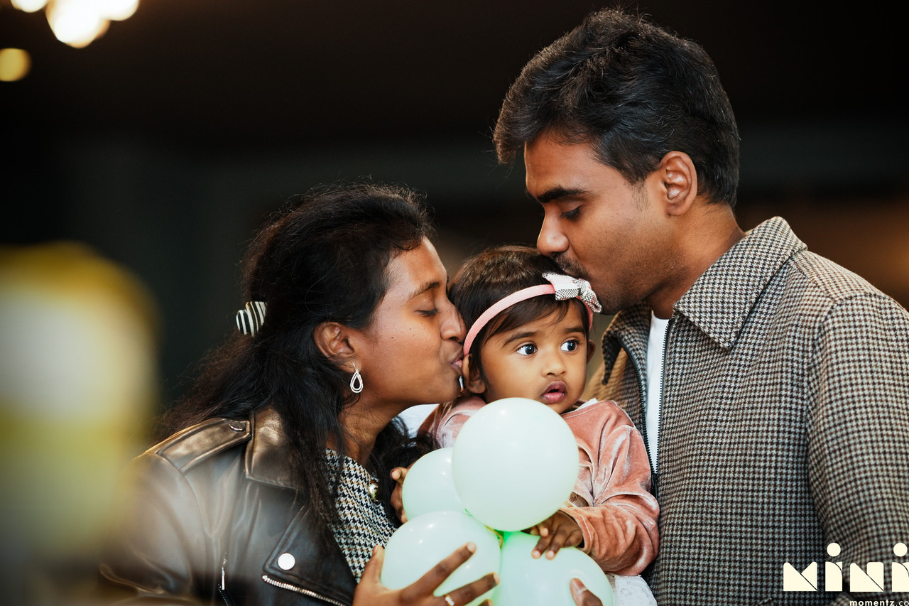 Indian first birthday photographer Milton Keynes — candid natural light celebration portrait