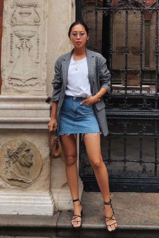a spring look with a white tee a blue denim mini a grey plaid blazer black strappy shoes and a brown