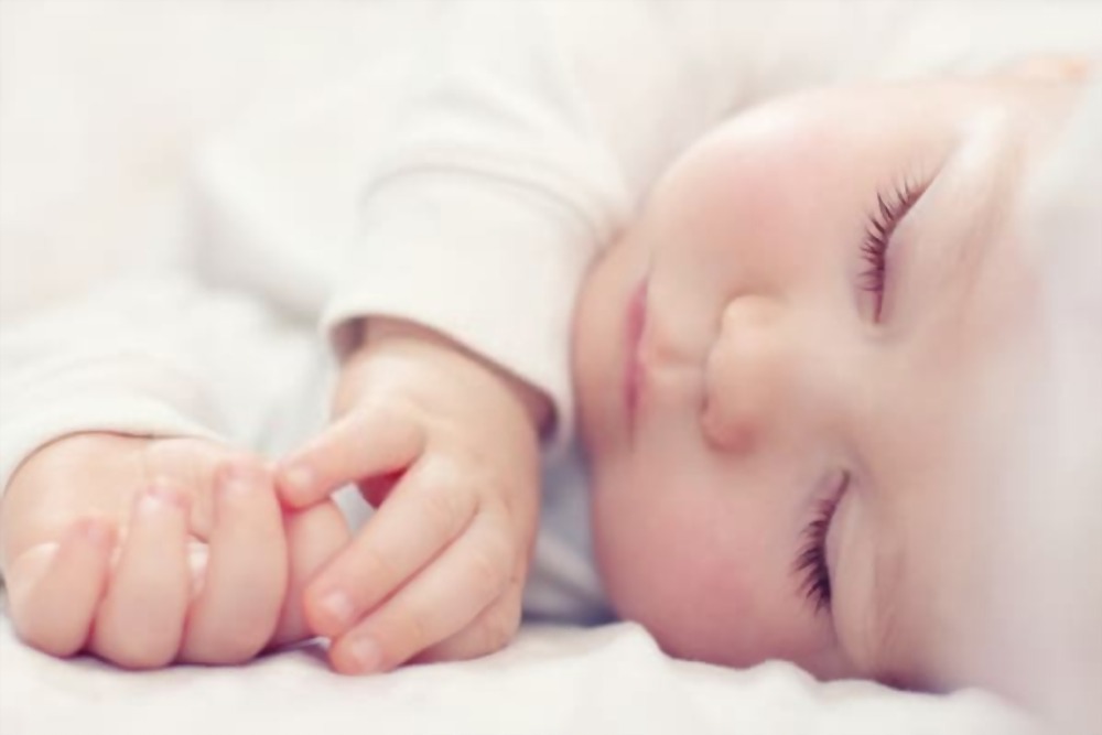 Sleeping baby in Fisher-Price Swing