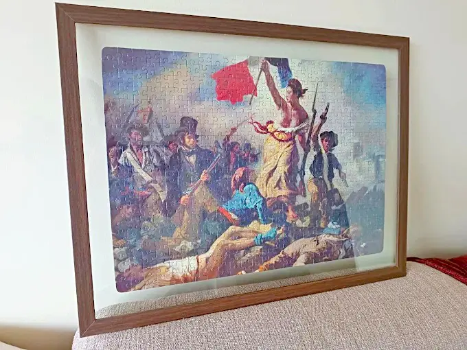 Quebra-cabeça emoldurado entre vidros