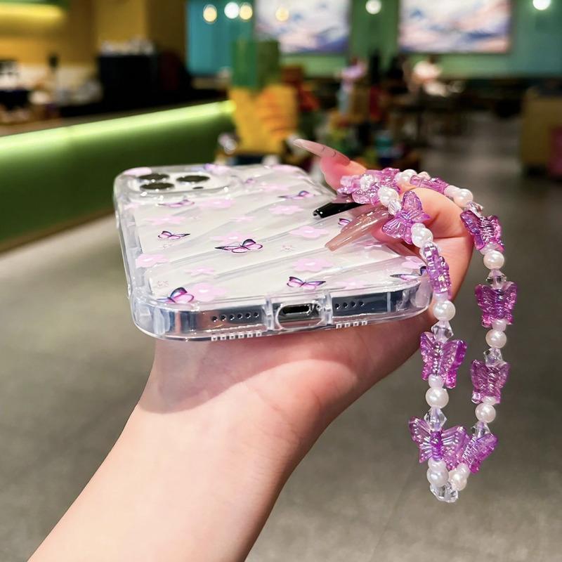 Foto de Funda transparente estampado floral. Incluye correa de mano.