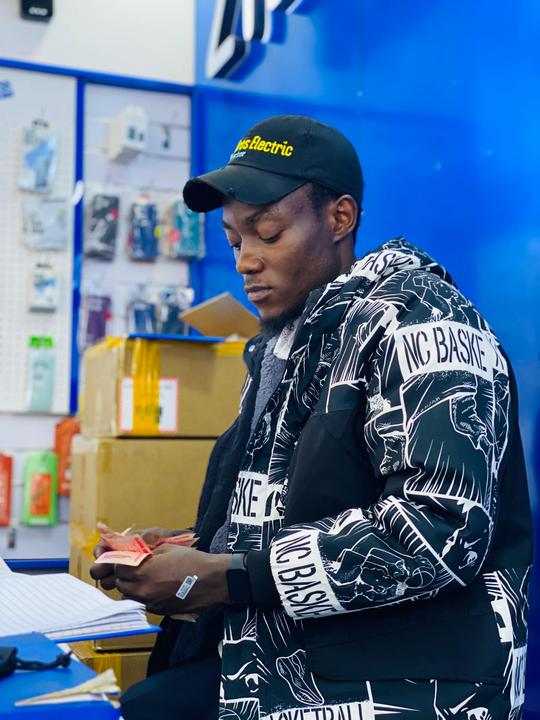 Ugandan phone shop with various models tempting buyers