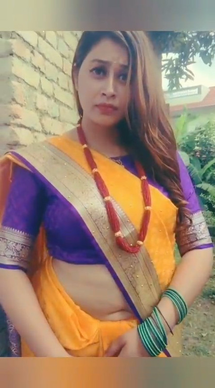 Beautiful Nepali Aunty Sexy open Big Deep Navel in Orange Saree.mp4_snapshot_00.01.870