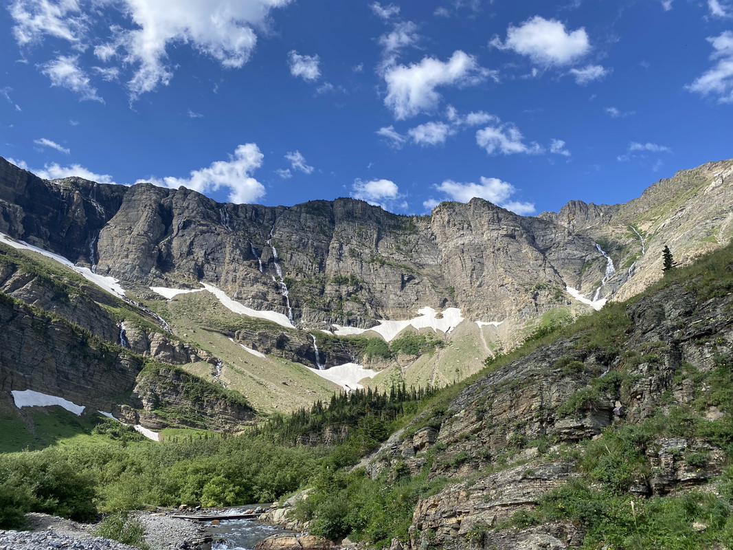 Alpine mountains, snow, and grass