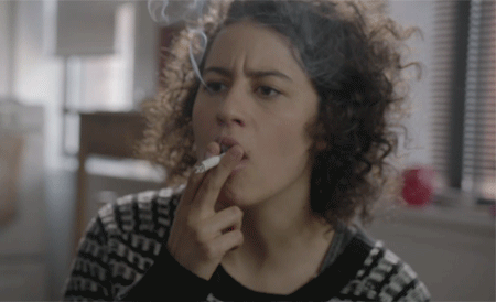 Ilana Glazer smoking a cigarette (or weed)
