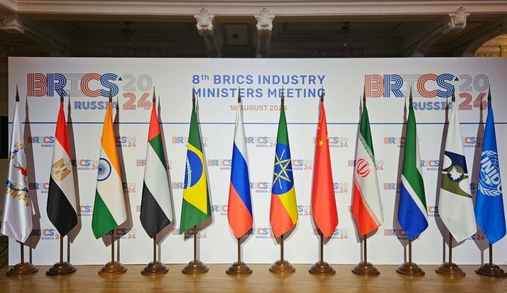 BRICS summit leaders standing together at international conference backdrop