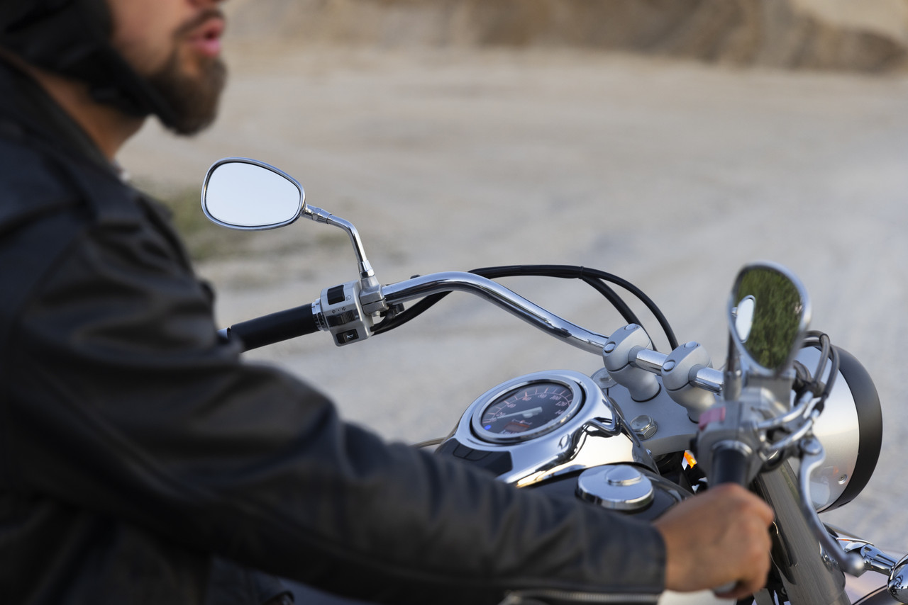 side view man riding motorbike