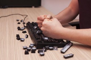 man-smashes-mechanical-computer-keyboard