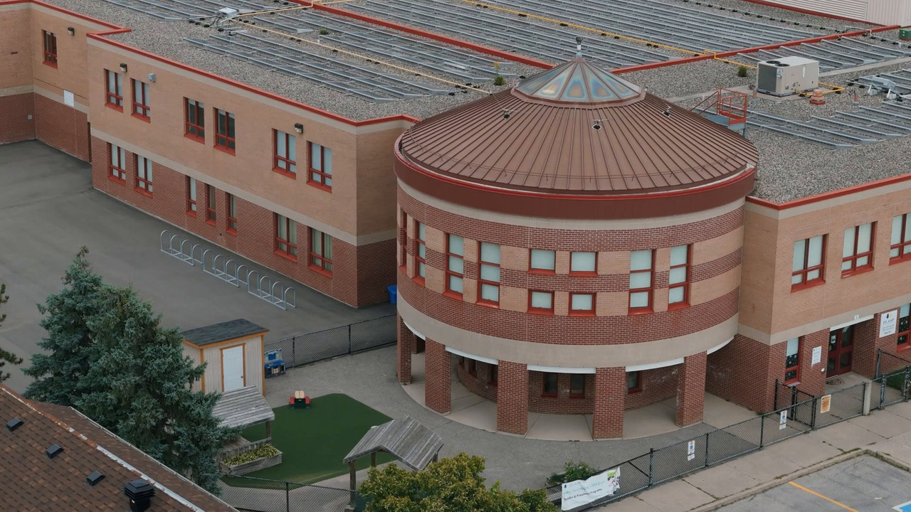 Aerial view of Fairwind Senior Public School in Mississauga with its brick rotunda and courtyard
