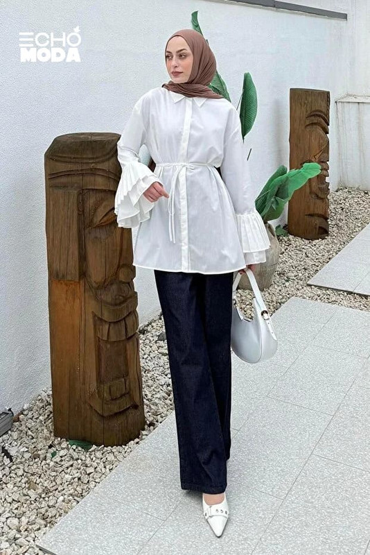 بلوزة طويلة بيضاء للنهار بستايل مريح وتفصيل ربطة خصر تضبط القوام برشاقة بلوزة طويلة بيضاء للنهار بستايل مريح وتفصيل ربطة خصر تضبط القوام برشاقة