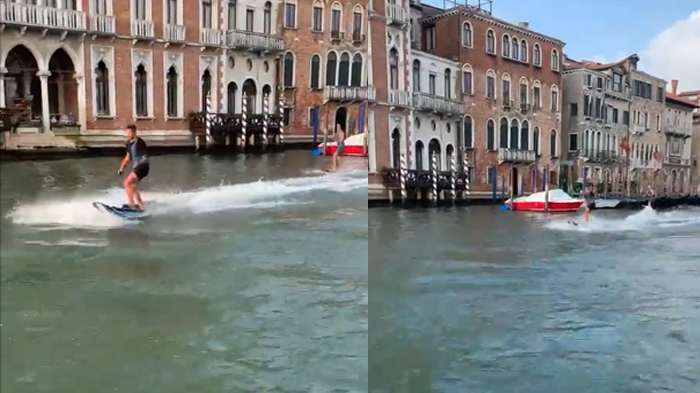 Turis berselancar di kanal Venesia