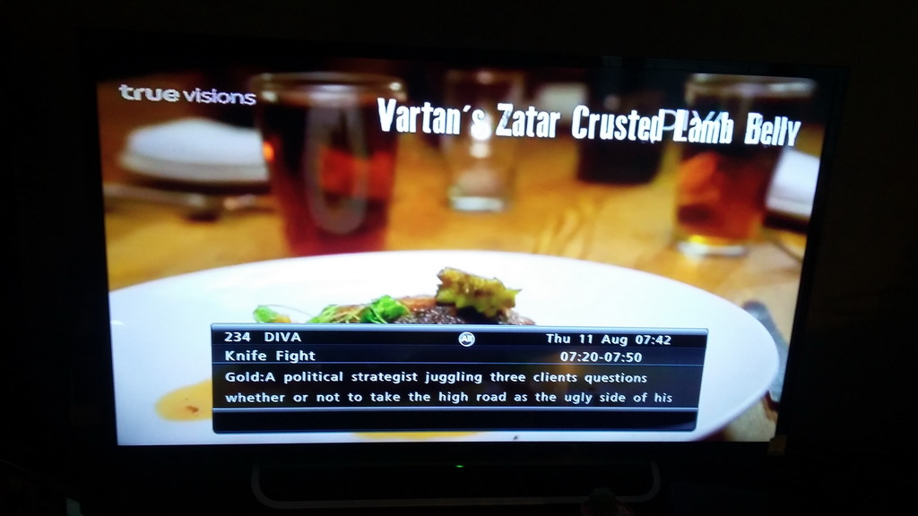 Same EPG synopsis as above over pictures of a Knife Fight contestant presenting his zatar crusted lamb belly