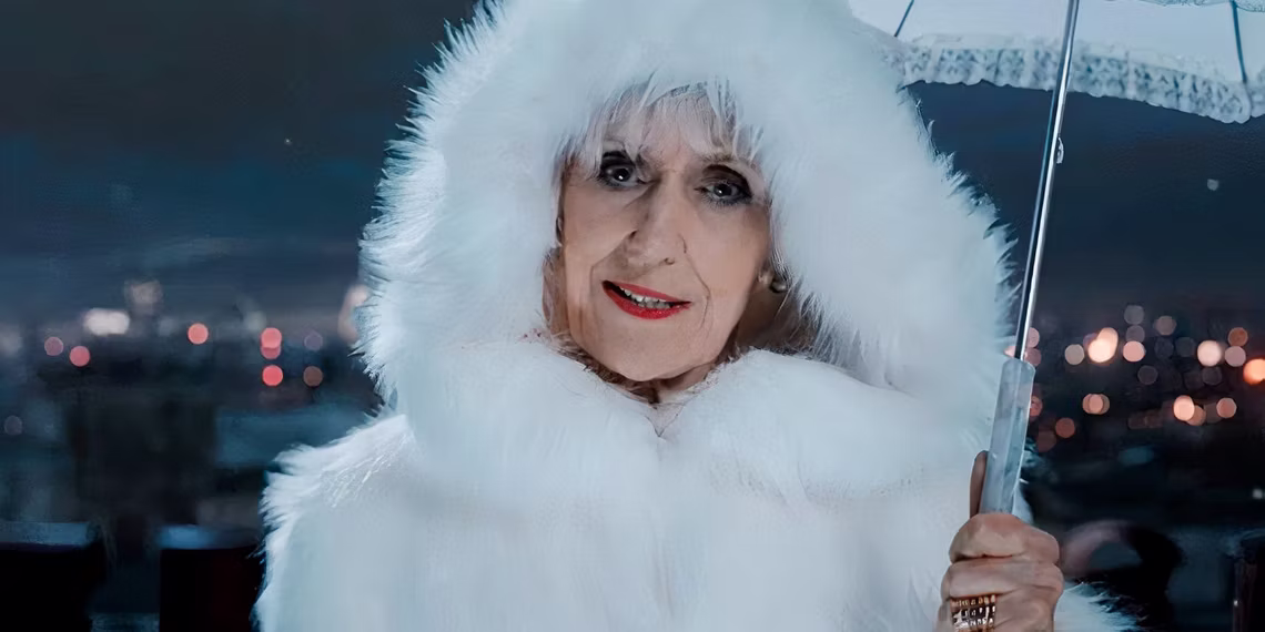 anita-dobson-as-mrs-flood-wearing-a-white-coat-in-doctor-who.avif