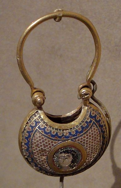 Close-up of Georgian Minankari cloisonne enamel jewelry showing vibrant blue, green and red sections separated by silver wire