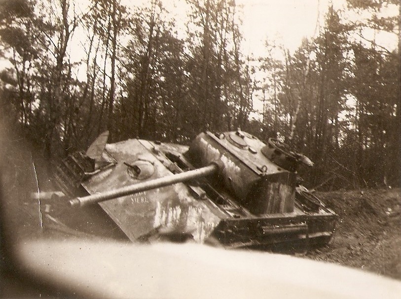 knocked out German Panther tank on the side of a road somewhere in Western Europe, c. 1945.