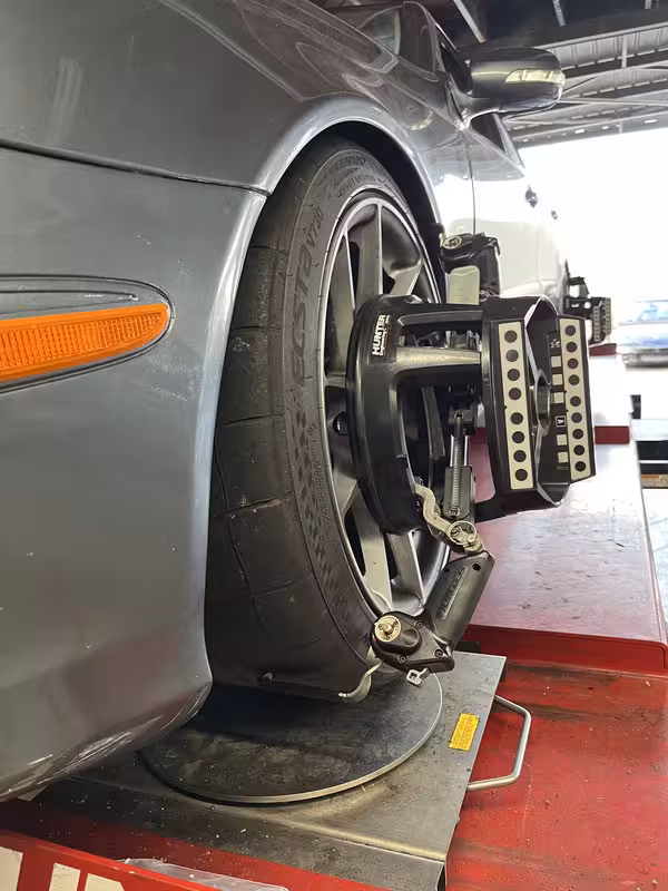 Even tread wear on performance tires after track use, showing optimized alignment and suspension