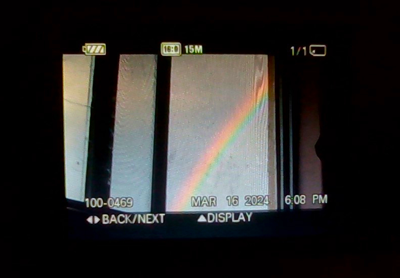 an image of an image of a rainbow taken from a camera taken from my laptop camera (2024)