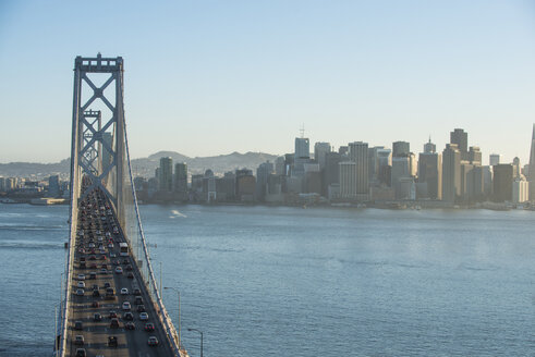 high-angle-view-of-cars-moving-on-oakland-bay-bridge-over-treasure-island-in-city-CAVF58195.jpg