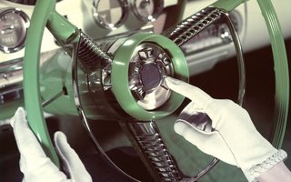 Image alt text: The steering where of a Ford Edsel showing the big chrome Teletouch buttons in the center
