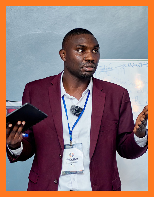 Dr Patient Kaloma, Co-Founder & CEO of MADEHub, smiling professional in business attire