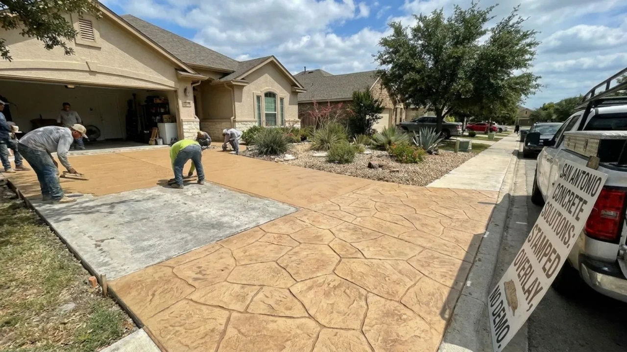 Finished stamped and colored concrete patio overlay on a San Antonio backyard  decorative stone pattern with sealed surface, no tear-out required