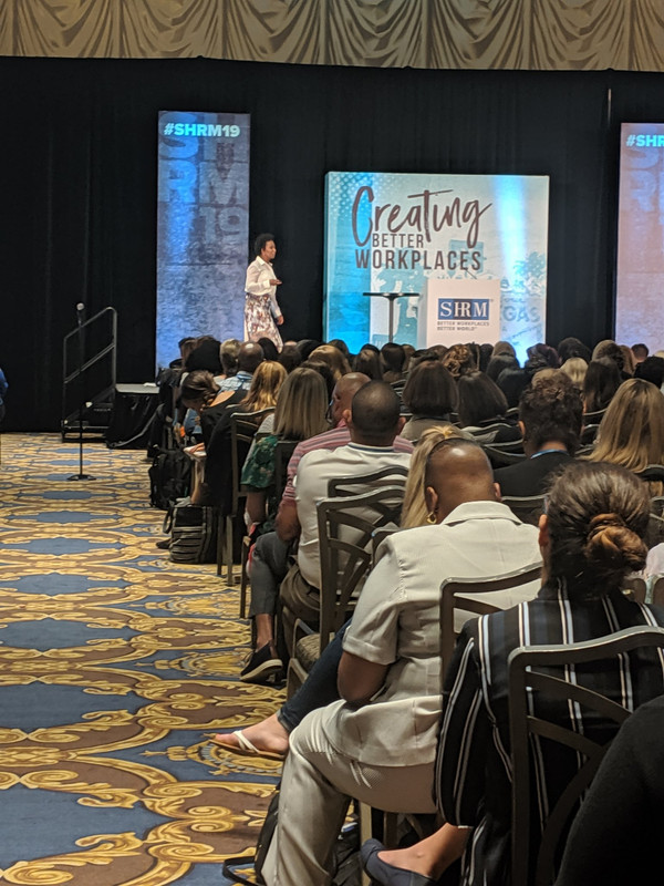 S. Renee Smith speaking to a large audience at SHRM