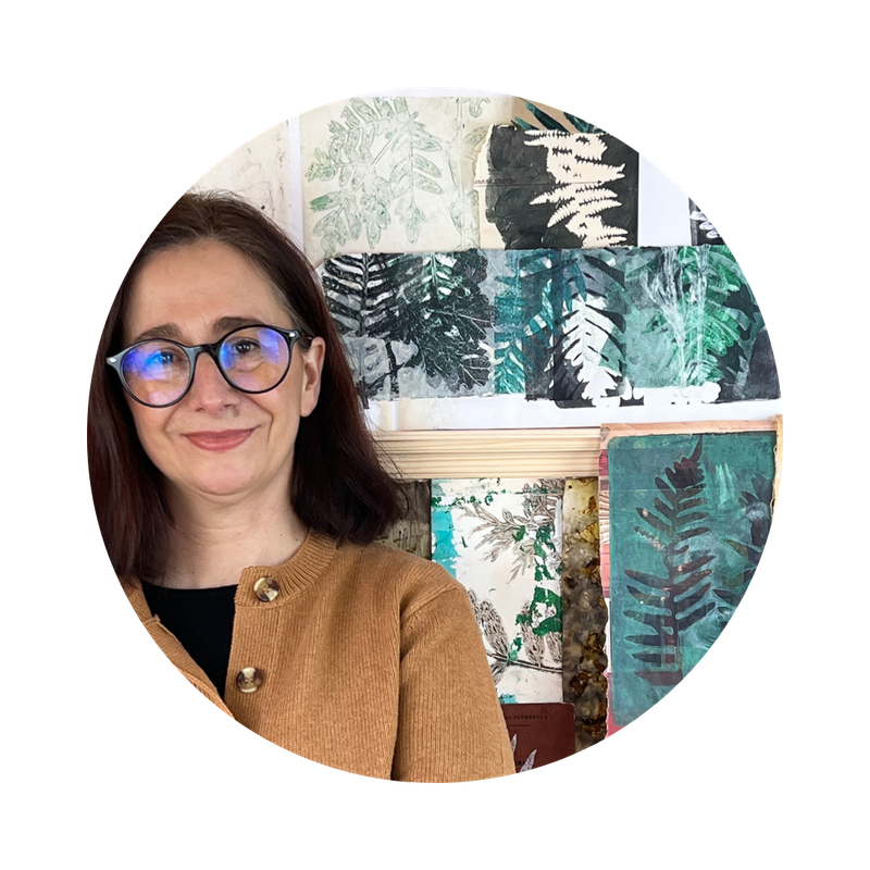 Francisca Nunes in her studio with journals and nature inspired work