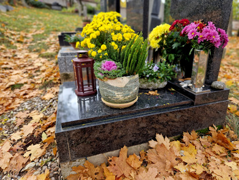 Flowers and Vases on top of Granite Headstone