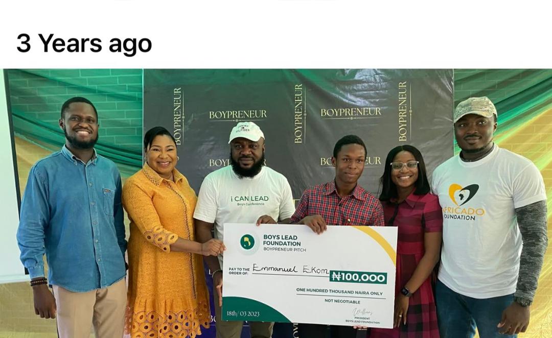 Past Boypreneur event showing leaders and a young winner receiving support