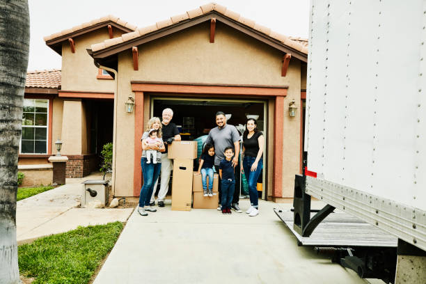 Apartment relocation specialist carrying boxes