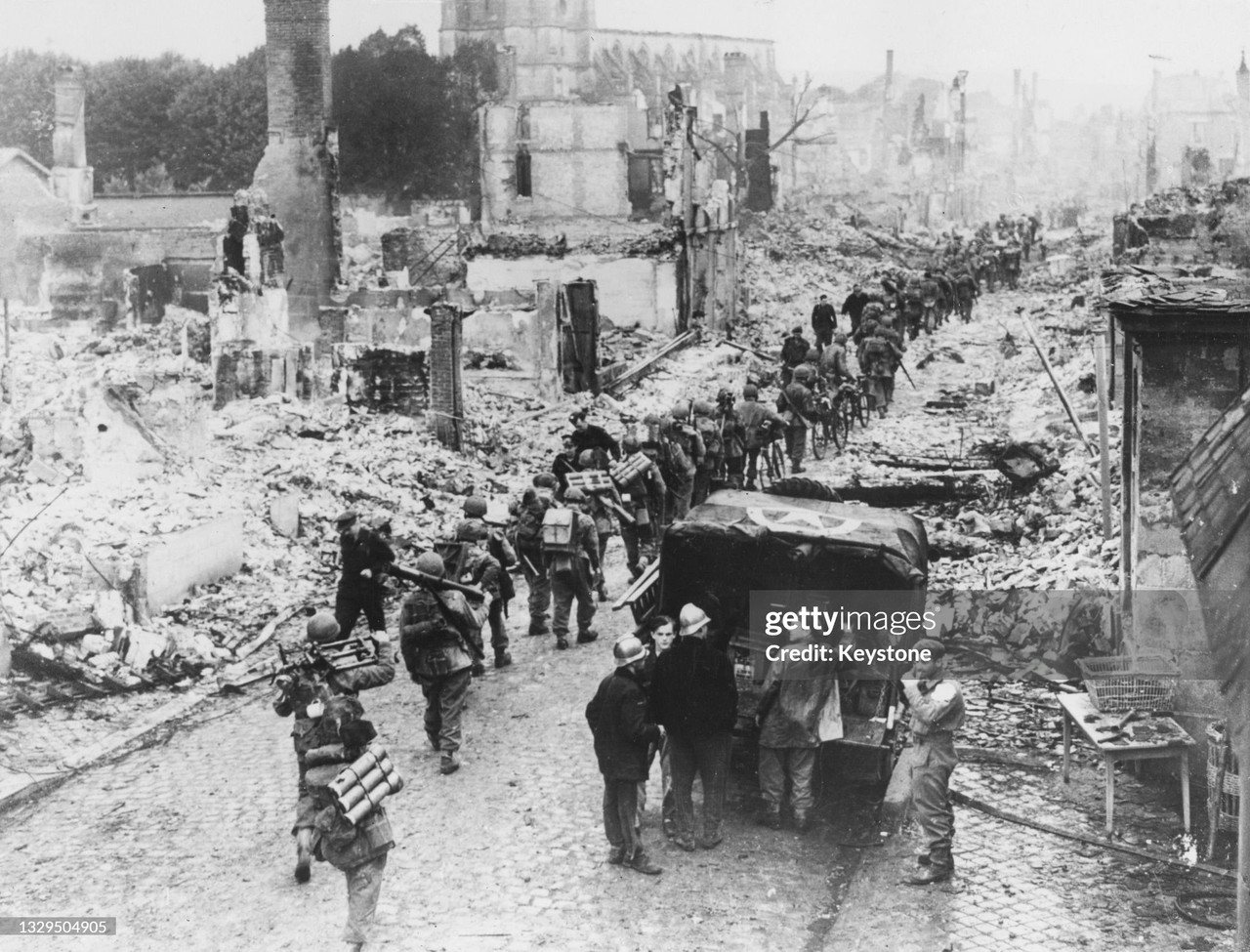 10 6th Airborne Brigade of the 6th Airborne Division Canadian Army enter the bomb damaged town of P