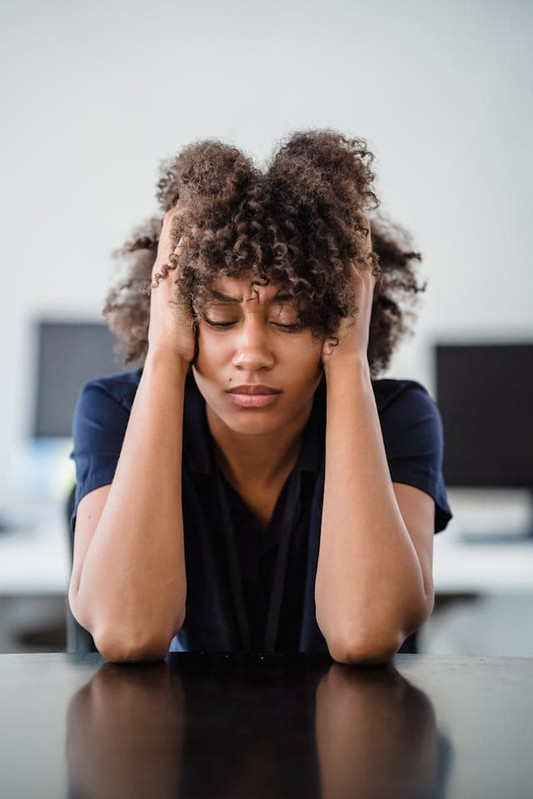 a girl under stress that’s affecting her gut health.