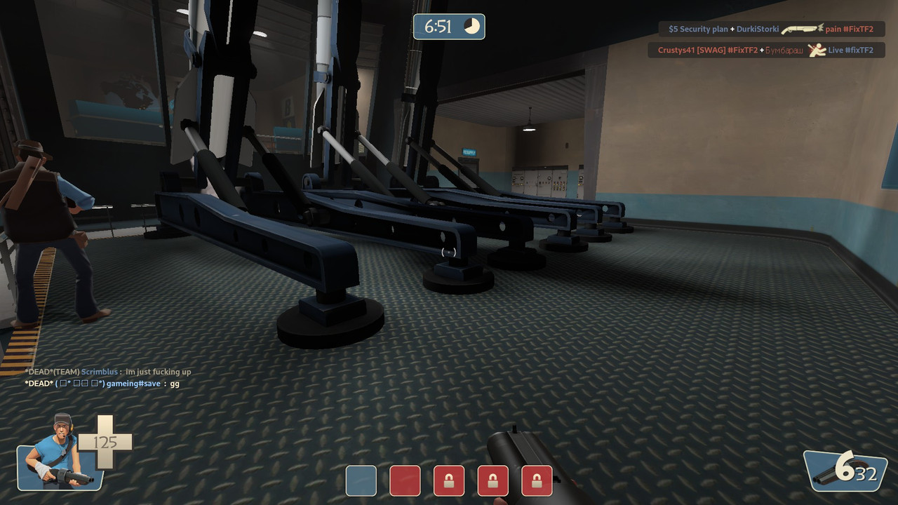 A screenshot taken in BLU’s spawn-room in Granary. The player is standing in the mid-section in the corridor, facing some missiles sitting in racks angled diagonally upwards.