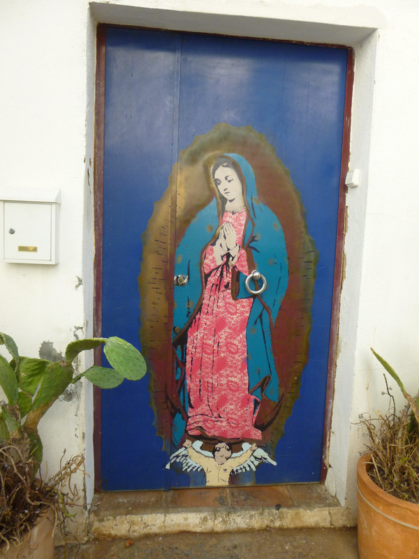 Door with a stencilled image of Mary