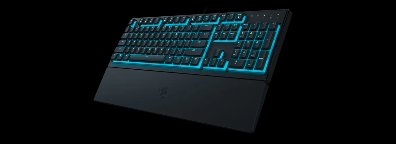 Teclado gaming Razer Ornata V3 X con iluminación RGB y reposamuñecas.