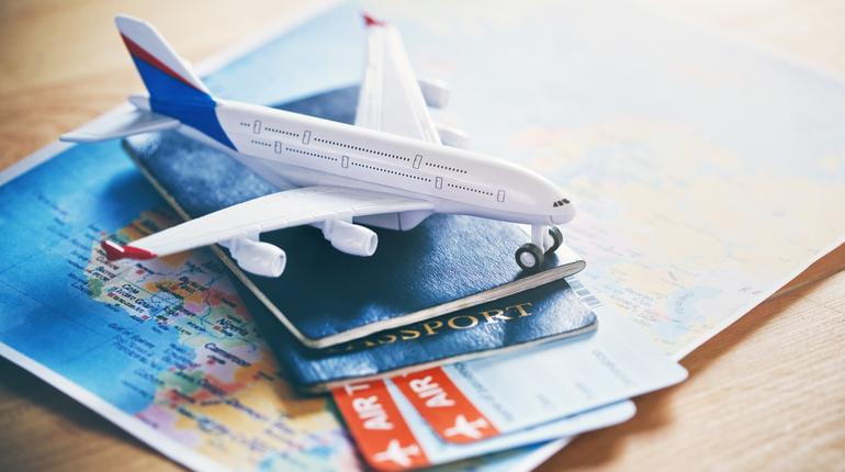 Air Ticketing — plane model with passport and tickets
