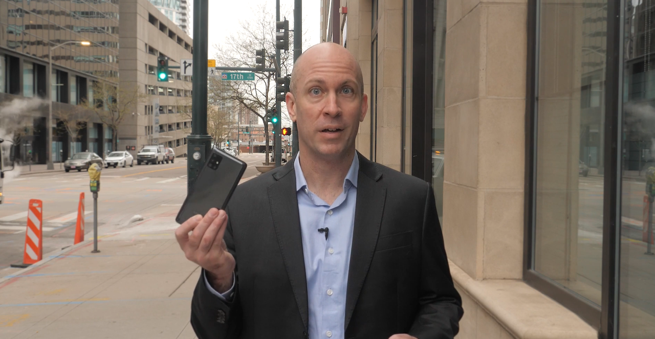 Image of Dave in Denver holding 5G Phone