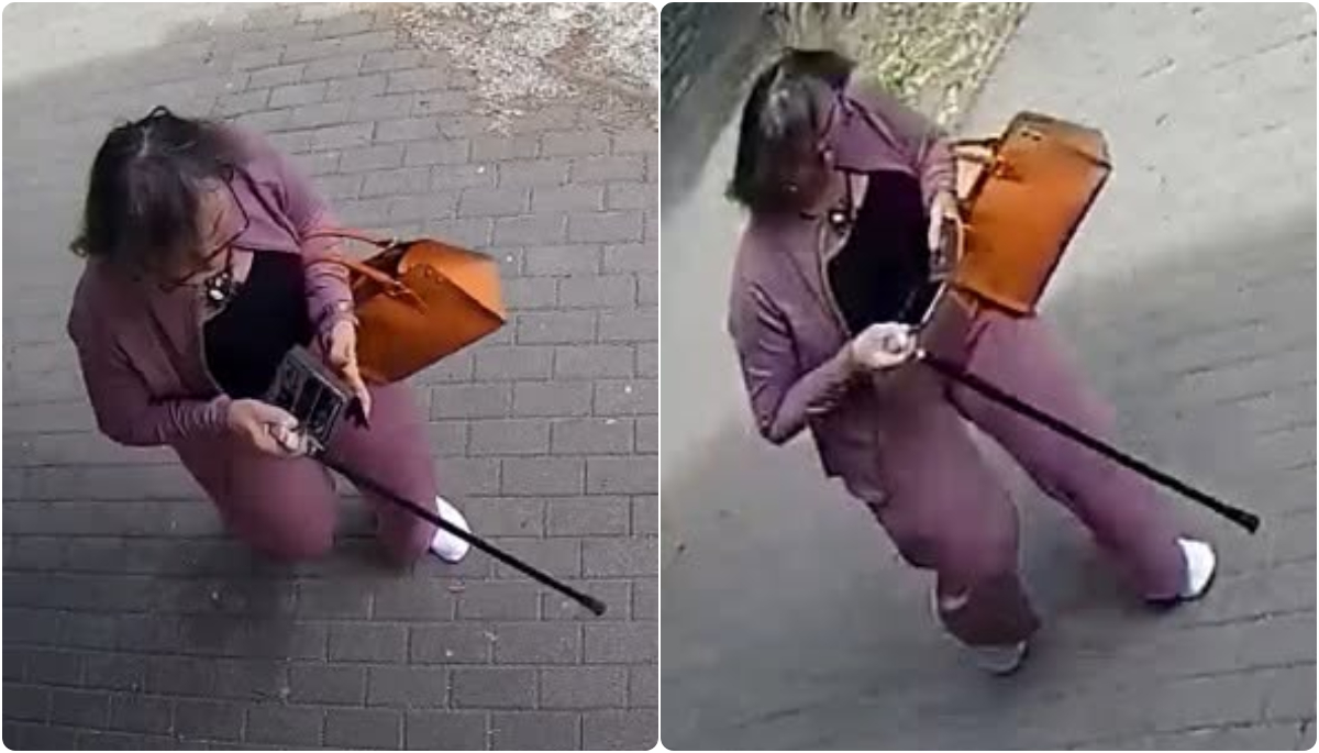 Na záberoch je žena vyfotená zhora. Má fialový komplet, čierne tričko, hnedú kabelku a biele tenisky. V ruke drží čiernu palicu a nasadené má okuliare. Do tváre jej nevidieť.