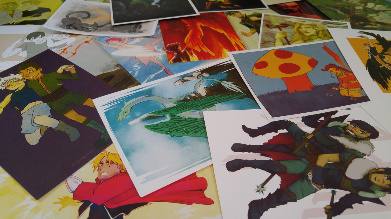photo of a pile of colorful mini prints of my art.
