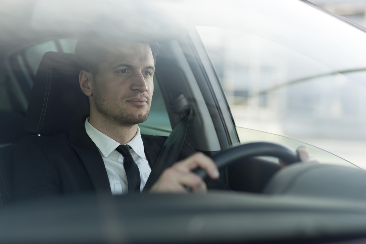 side view modern man driving