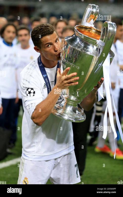 real madrids cristiano ronaldo celebrates with the uefa champions league trophy after victory over a