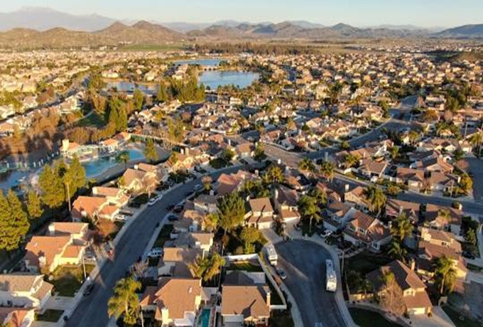 Aerial view of a California residential neighborhood showcasing houses, streets, and greenery.