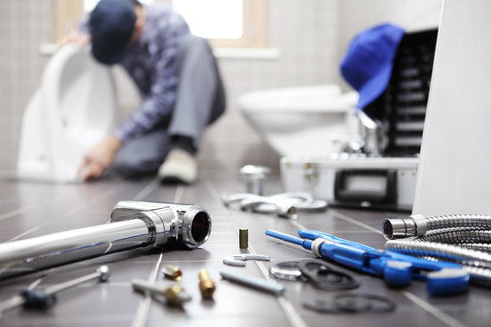 Goldenvalve Plumbing technician working on a residential plumbing system