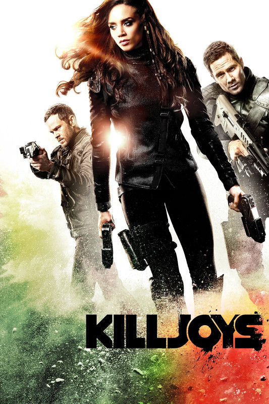 Three people in leathery scifi bodysuits holding guns.
