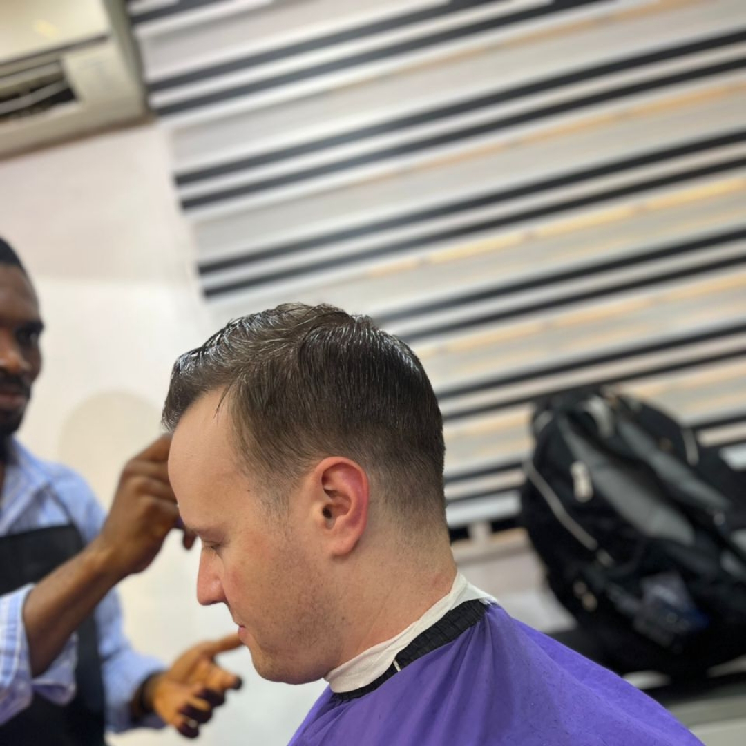 Detailed hair design work on a client