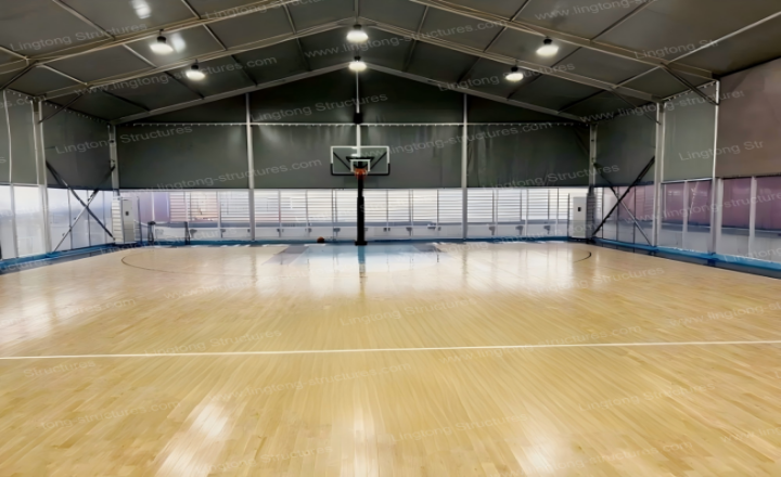 Professional basketball training center inside column-free tent with multiple courts