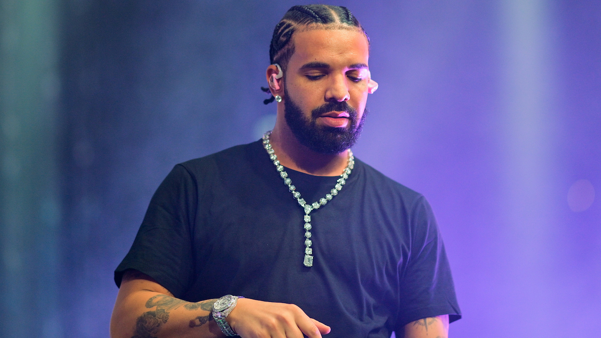 Drake at a concert looking into the crowd